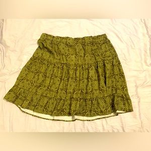 Short, bright skirt, plus size, fits like 1XL. Olive/ yellow-green patterned.